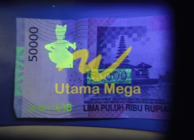 Pedeteksi Uang Palsu Dengan Kaca Pembesar